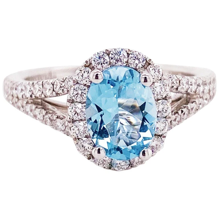 Oval Aquamarine and Diamond Halo Engagement Ring